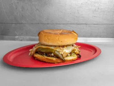Chiloria Burger from Lonches Sota, featuring chiloria (spiced shredded pork).